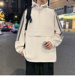 Detail showing white hooded jacket with half-zip, kangaroo pocket and gray striped sleeves