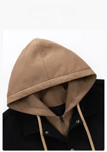 Detailed close-up of hooded jacket with brown faux suede hood and bronze metal hardware