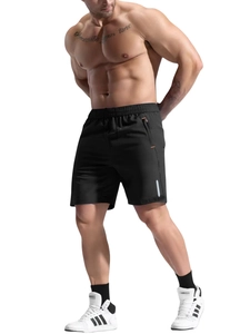 Detail of men's quick-dry sports shorts showing orange zipper pocket and reflective strip