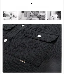 Detail of waffle textured jacket featuring chest pocket and silver metal button accent