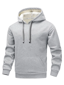 Detail of gray hoodie showing thick white sherpa lining and soft textured knit fabric