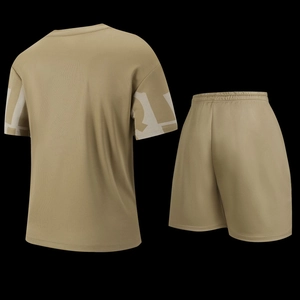 Detail view of khaki sports set showing breathable mesh fabric and white geometric sleeve prints