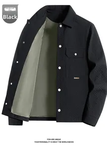 Detail of black waffle texture men's jacket with turn-down collar and chest pocket