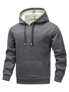 Detail of dark grey hoodie featuring soft white sherpa fleece lining and black drawstrings