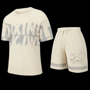 Close-up of cream-colored honeycomb mesh fabric with gray geometric printing on sport suit