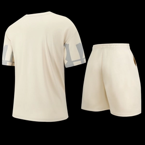 Detail view of beige casual sports set with breathable mesh fabric and geometric sleeve print