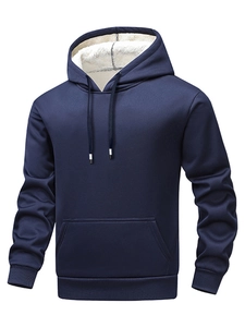Detailed close-up of navy hoodie showing white sherpa fleece lining and ribbed cuffs