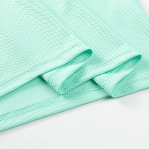 Detail of light mint green breathable mesh fabric with premium double needle hem stitching