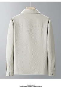 Detail view of the back seam and premium waffle texture fabric on this light gray men jacket
