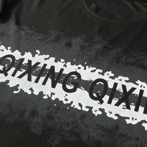 Detail of black sports T-shirt featuring breathable mesh fabric and QIXING QIXI print