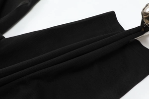 Close-up of black mesh fabric with breathable honeycomb texture for summer sportswear