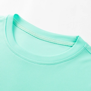 Close-up of mint green crew neck showing breathable honeycomb mesh fabric and stitching