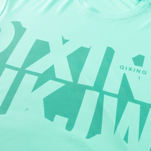 Detail of mint green breathable mesh fabric with dark green geometric graphics