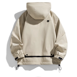 Detail view of water-resistant mountain jacket with adjustable hem and functional straps