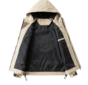 Detail of adjustable drawstring hood and waterproof khaki fabric on a functional jacket