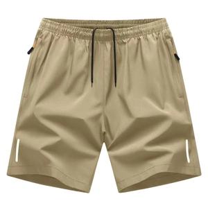 Detail of khaki sports shorts with elastic waist, drawstring and reflective strips