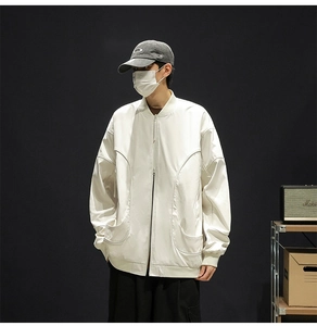 Close-up of off-white baseball collar jacket with curved oversized front pockets