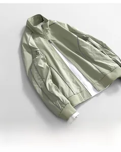 Detail of water-resistant oxford fabric jacket featuring grey stripes and ribbed cuffs