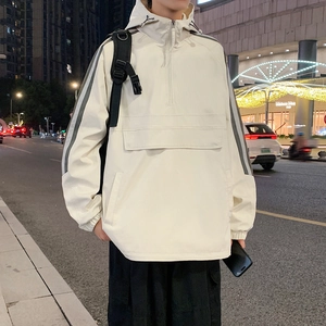 Men's cream hooded anorak jacket with front pocket and grey side stripes outdoors