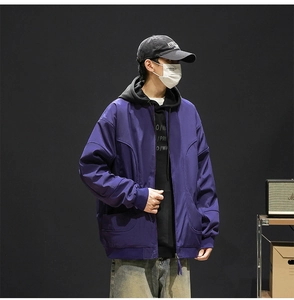 Detail view of water-resistant deep purple baseball collar jacket with utility pockets
