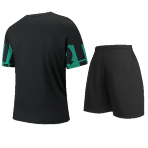 Men's athletic set with black t-shirt and shorts featuring green sleeve graphic back view