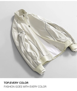 Detail view of water-repellent oxford jacket with grey piping and ribbed cuffs