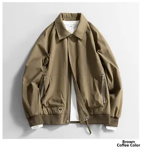 Detailed close-up of a brown cargo jacket with zipper pockets and ribbed cuffs