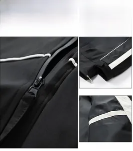 Details des Metallreißverschlusses und der Klettbündchen an der schwarzen Windjacke