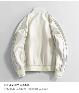 Detail view of the back of a cream water-repellent jacket with grey contrast piping details