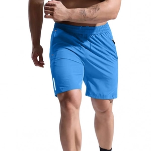 Men's blue quick-dry athletic shorts with orange zipper pockets and white reflective stripes