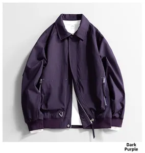 Detailed view of the deep purple workwear jacket featuring a zipper pocket and ribbed cuffs