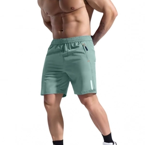 Men's slim fit quick-dry sports shorts in sage green with elastic waist and side pockets