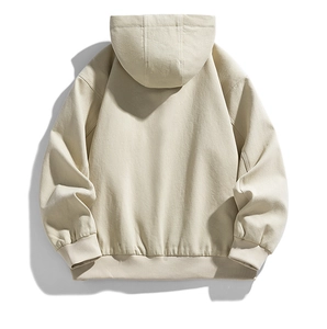 Rear view of cream-colored hooded jacket featuring ribbed cuffs and hem with textured fabric