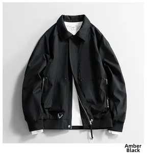 Detail view of amber black jacket featuring windproof fabric and utility cargo pockets
