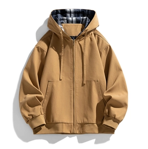 Detail of khaki hooded jacket featuring plaid lining and durable metal zipper closure