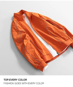 Detail view of water-resistant orange oxford jacket with zipper and reflective piping