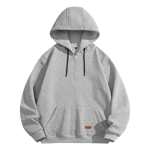 Men's light grey half-zip hoodie with front pocket and contrasting drawstrings on white background