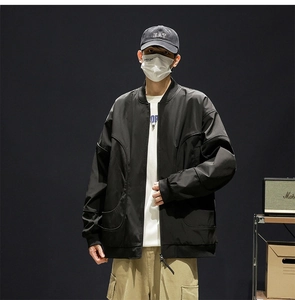 Front view of black bomber jacket featuring classic ribbed collar and water-resistant fabric