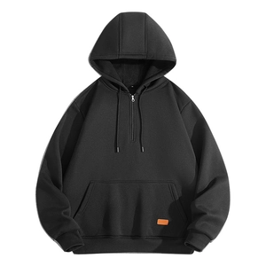 Men's black half-zip hoodie with drawstring hood, kangaroo pocket and orange logo tag