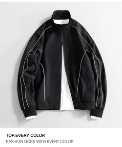 Close-up of black hooded jacket featuring contrast white piping and water-repellent fabric