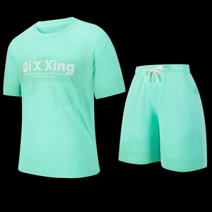 Detail of mint green sportswear set showing breathable mesh fabric and drawstring waist
