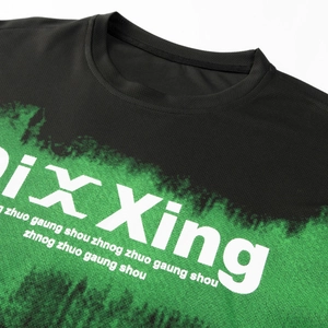 Detail of black breathable mesh t-shirt with green splatter print and ribbed neckline