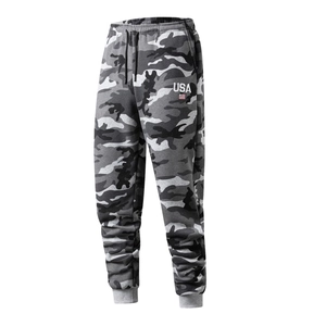 Detail of men's camo jogger showing USA print, elastic waist with drawstring and ribbed cuffs