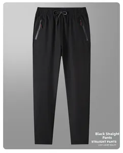 Flat lay of men's straight ice silk pants with elastic drawstring waist and zip pockets