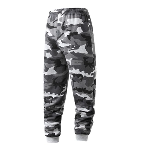 Macro detail of elastic waistband and gray ribbed cuffs on camo jogger pants