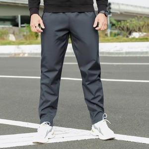 Close-up of men's dark grey lamb fleece winter pants with elastic waist and side pocket