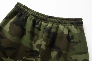 Detail view of elastic waistband and camouflage print on premium joggers for outdoor activities