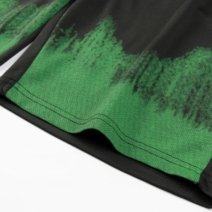 Detail of breathable mesh fabric with green mountain print and high-quality double-needle stitching
