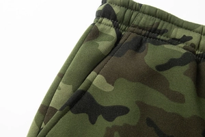 Close-up of jungle camouflage cargo pants featuring elastic waistband and side pockets