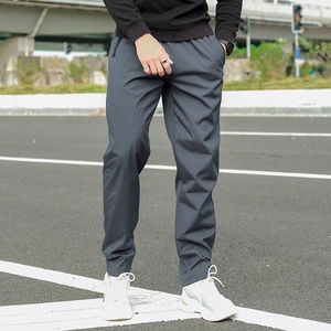 Detail of men's dark grey fleece-lined thermal casual pants with zip pocket in urban style
